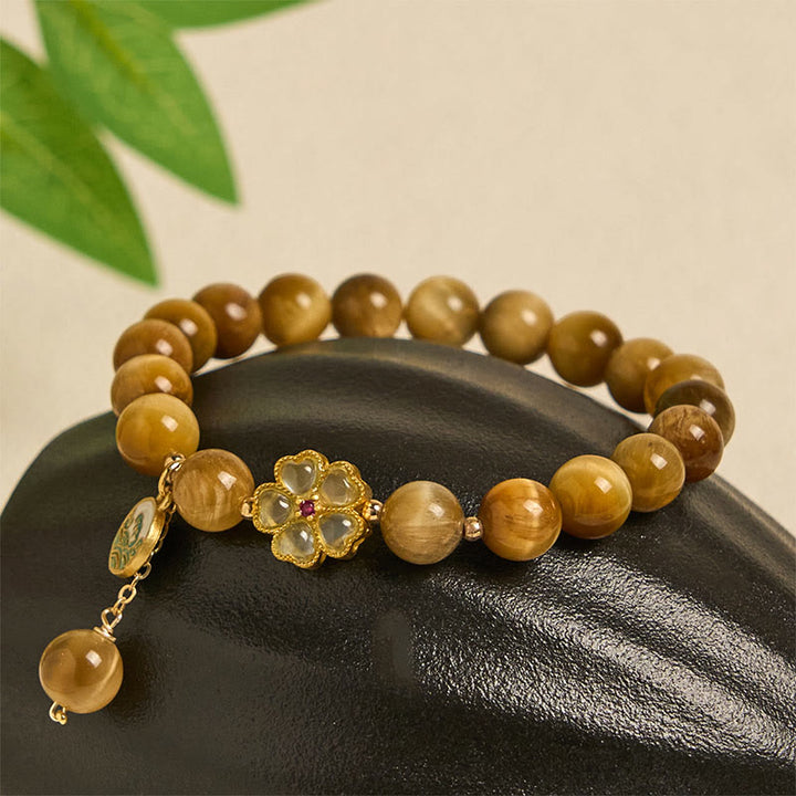 Bracelet courage en forme de clochette et œil de tigre doré naturel Buddha Stones - image 6