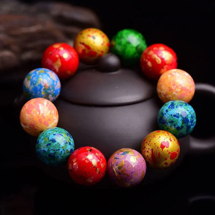 Bracelet de protection à un tour en perles de santal, laqué multicolore et orné de Buddha Stones - image 1