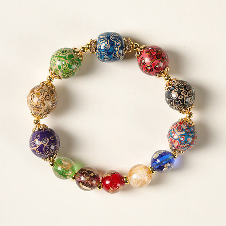 Bracelet artisanal en Buddha Stones, verre Liuli coloré, calebasse en bois de santal et perles laquées. - 12 mm - image 0
