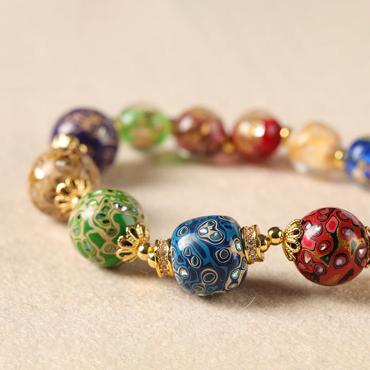Bracelet artisanal en Buddha Stones, verre Liuli coloré, calebasse en bois de santal et perles laquées. - image 2