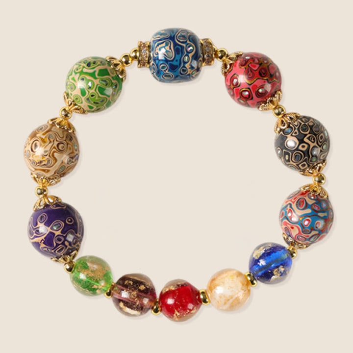 Bracelet artisanal en Buddha Stones, verre Liuli coloré, calebasse en bois de santal et perles laquées. - image 6