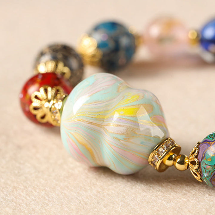 Bracelet artisanal en Buddha Stones, verre Liuli coloré, calebasse en bois de santal et perles laquées. - image 13