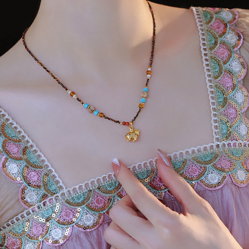 Collier pendentif œil de tigre en Buddha Stones, protection année dorée du Cheval - image 4