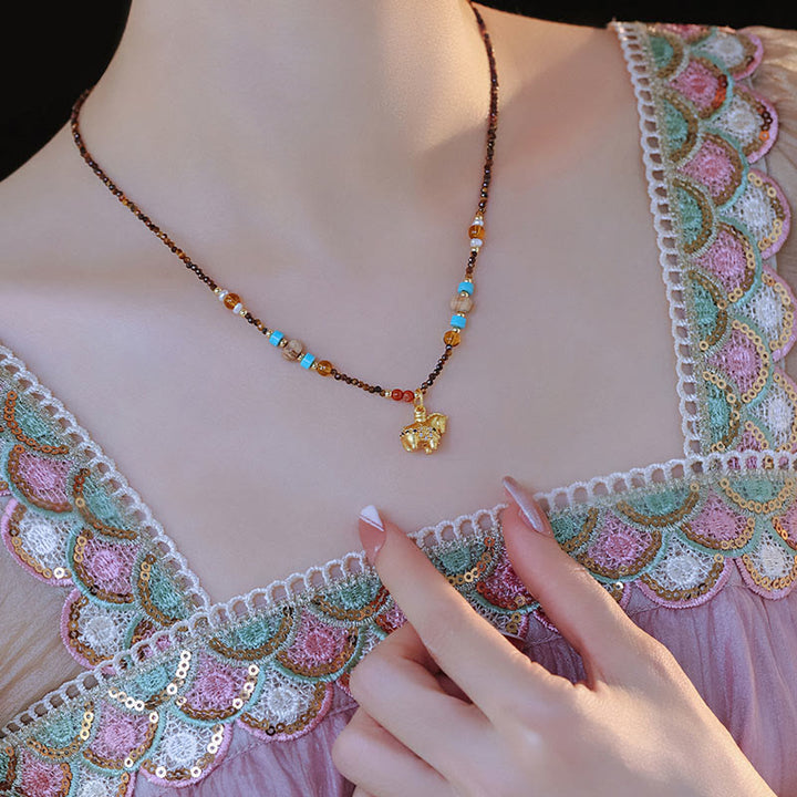 Collier pendentif œil de tigre en Buddha Stones, protection année dorée du Cheval - image 4