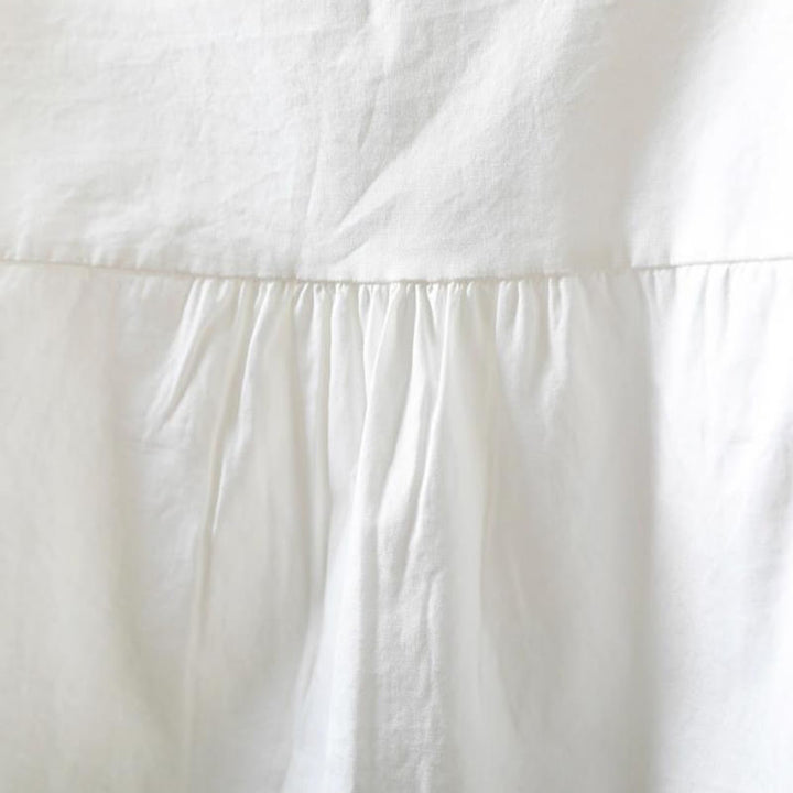 Chemise à manches longues en coton pour femme, ornée de boutons et de plis accordéon blancs à motifs de Buddha Stones - image 6