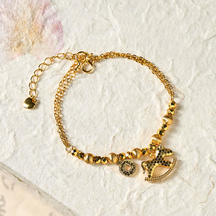 Bracelet porte-bonheur en cuivre plaqué or 24 carats, orné de Buddha Stones l'année du Cheval du zodiaque chinois. - image 1