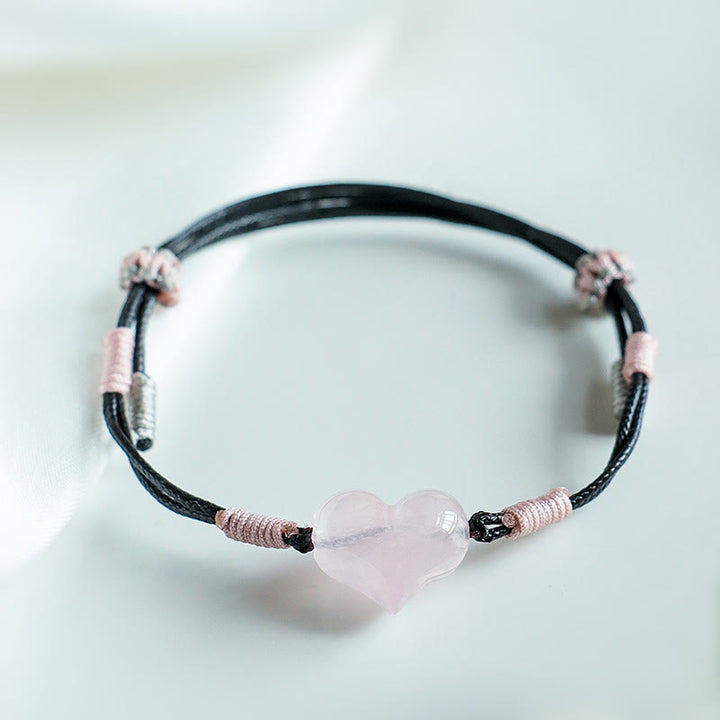 Bracelet chaleureux en Buddha Stones, breloque cœur en cristal rose naturel et cordon tressé. - image 7