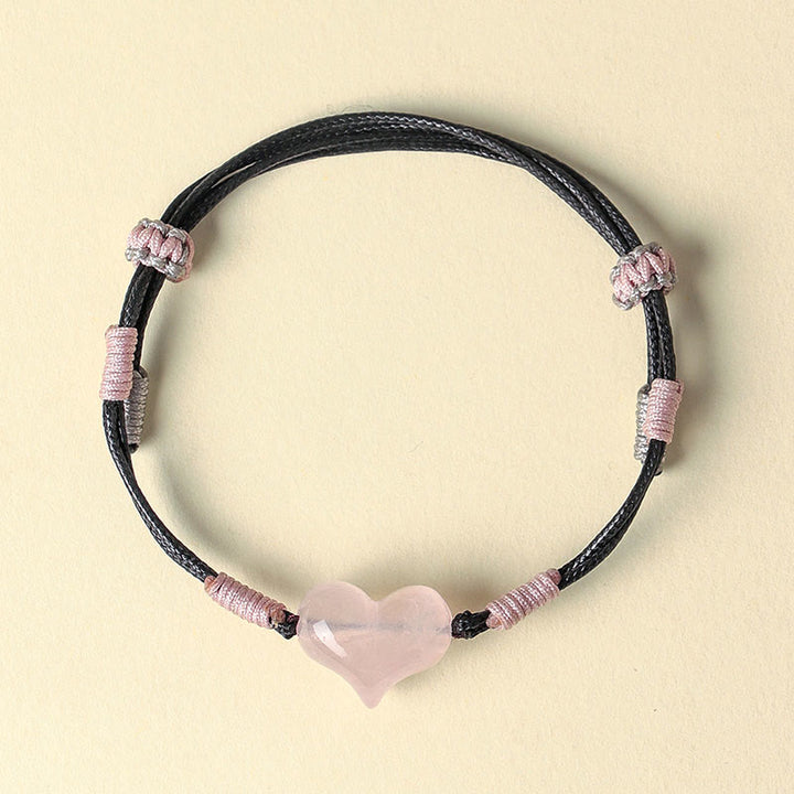 Bracelet chaleureux en Buddha Stones, breloque cœur en cristal rose naturel et cordon tressé. - image 2