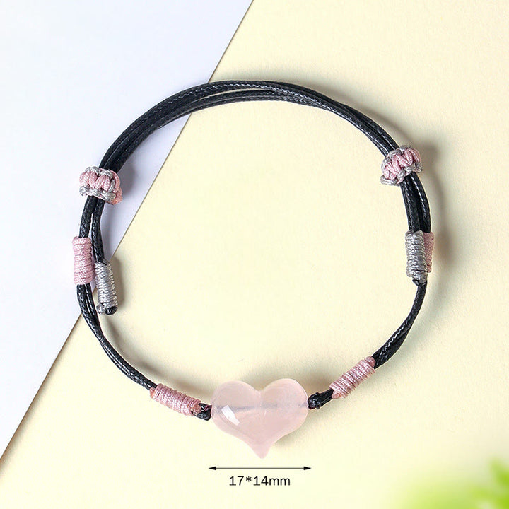 Bracelet chaleureux en Buddha Stones, breloque cœur en cristal rose naturel et cordon tressé. - image 4