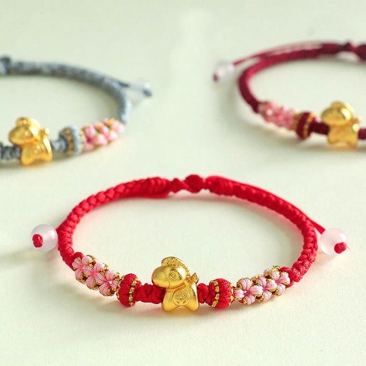 Bracelet porte-bonheur en Buddha Stones, année du Cheval, ficelle multicolore, nœud de fleur de pêcher et ficelle rouge. - image 0