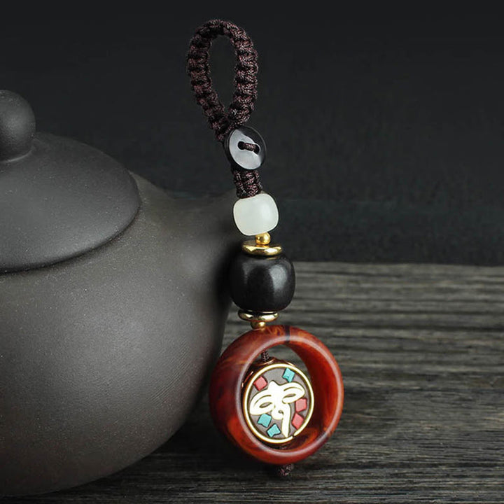 Buddha Stones, bois d'ébène, trèfle à quatre feuilles sanskrit, œil de Bouddha, porte-clés rotatif de paix - Motif de l'œil de Bouddha - image 6