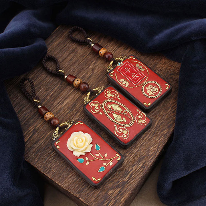 Buddha Stones Fleur d'ébène Poisson Koi Bouton Porte-clés Corde - image 0