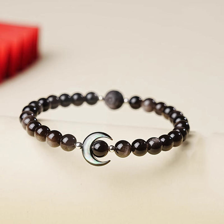 Bracelet de protection en perles d'obsidienne naturelle argentée, motif lune et Buddha Stones - Obsidienne à reflets argentés (Tour de poignet : 15-17 cm) - image 0