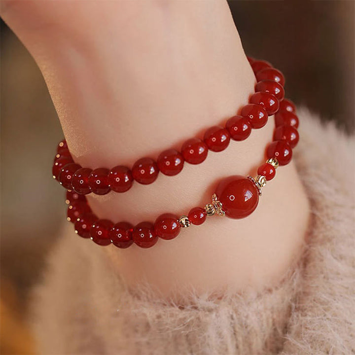 Bracelet de confiance et d'acceptation de soi en perles d'agate rouge à double tour de Buddha Stones - image 0