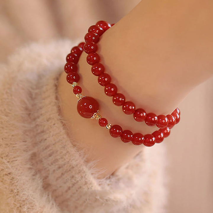 Bracelet de confiance et d'acceptation de soi en perles d'agate rouge à double tour de Buddha Stones - image 2