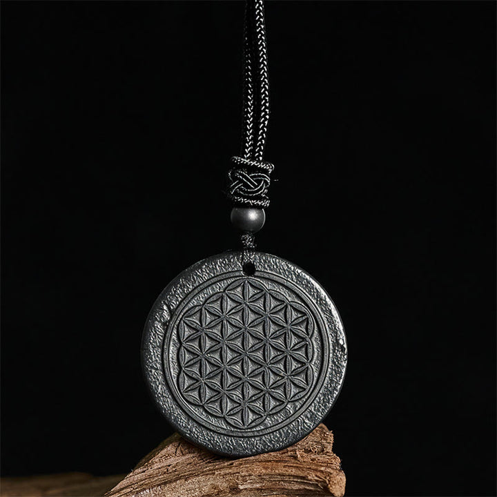 Collier pendentif en Buddha Stones, motif Fleur de Vie, sculpté dans une authentique pierre de shungite, symbole de protection. - image 2