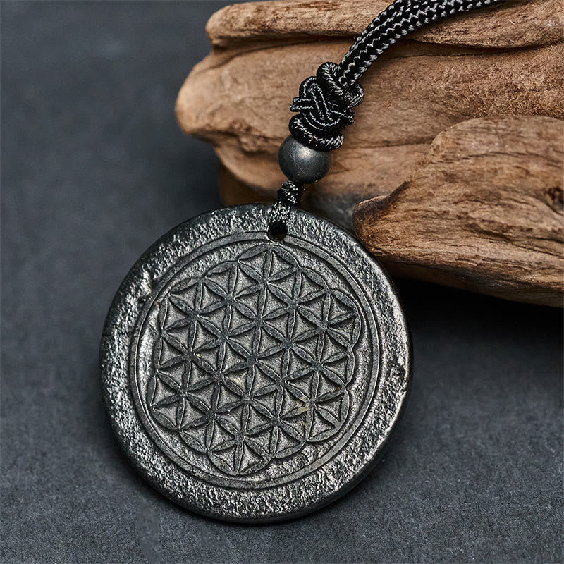 Collier pendentif en Buddha Stones, motif Fleur de Vie, sculpté dans une authentique pierre de shungite, symbole de protection. - image 1