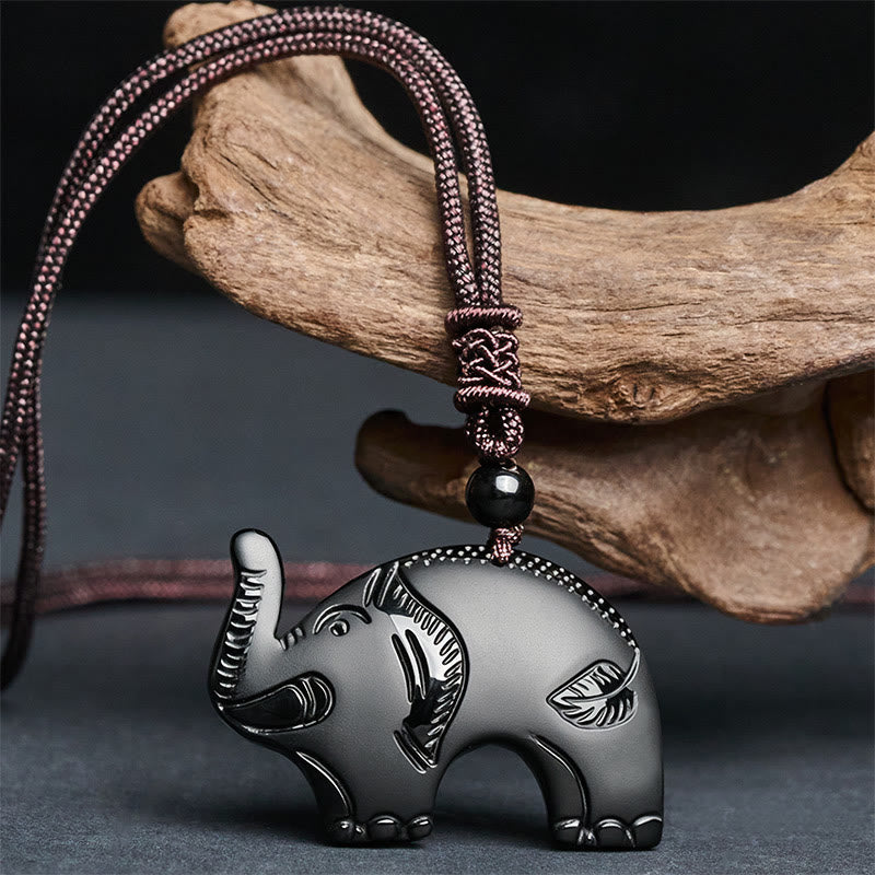 Pendentif en obsidienne noire sculptée, orné d'un éléphant et représentant la force, inspiré des Buddha Stones. Collier avec pendentif - image 1