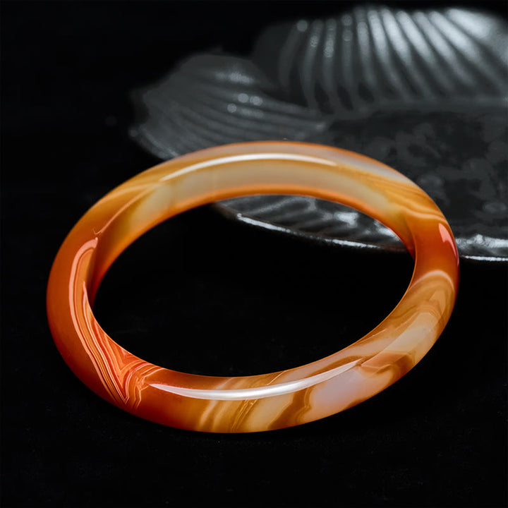 Bracelet jonc apaisant en agate rouge veinée de Buddha Stones - image 1