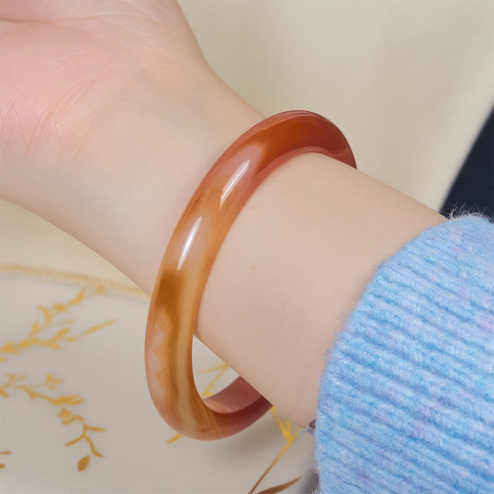 Bracelet jonc apaisant en agate rouge veinée de Buddha Stones - image 4