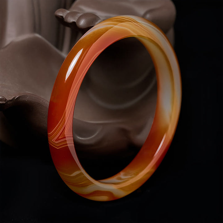 Bracelet jonc apaisant en agate rouge veinée de Buddha Stones - Agate rouge (Pensée logique ♥ Acceptation de soi) - 61-62 mm - image 0