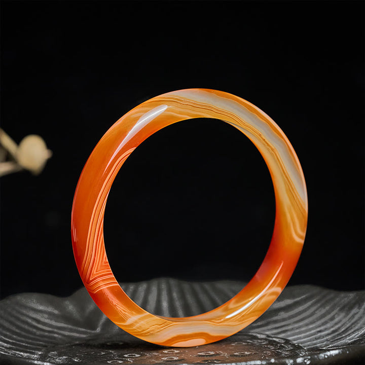 Bracelet jonc apaisant en agate rouge veinée de Buddha Stones - image 2