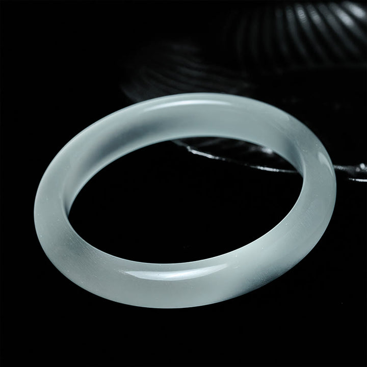 Bracelet jonc spirituel en Buddha Stones œil-de-chat blanc, symbole d'abondance et de spiritualité - image 1