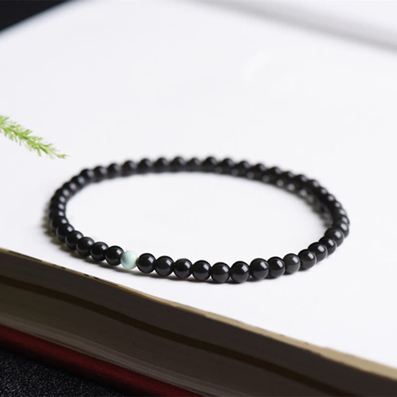 Bracelet de force et d'épanouissement en obsidienne noire et turquoise de Buddha Stones - image 3