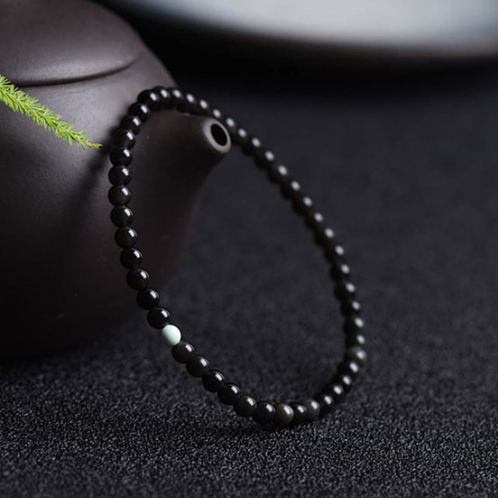 Bracelet de force et d'épanouissement en obsidienne noire et turquoise de Buddha Stones - image 2