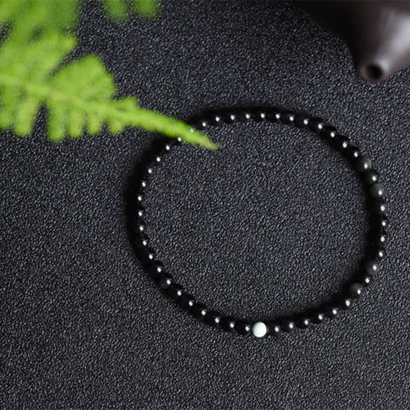 Bracelet de force et d'épanouissement en obsidienne noire et turquoise de Buddha Stones - image 1