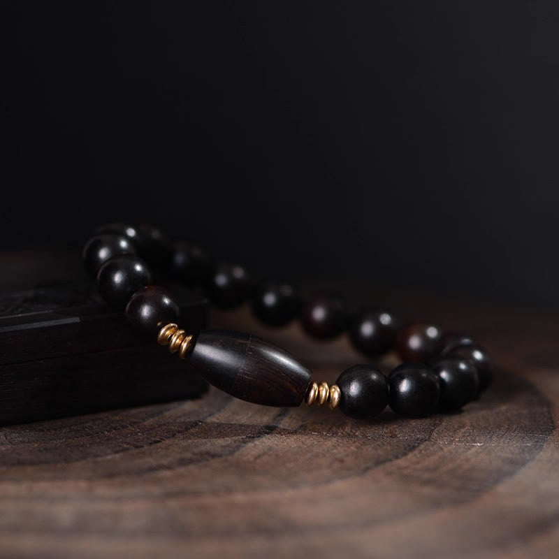 Bracelet de protection en perles d'ébène et Buddha Stones, orné d'un parchemin de sutra et symbole de bénédiction. - image 4