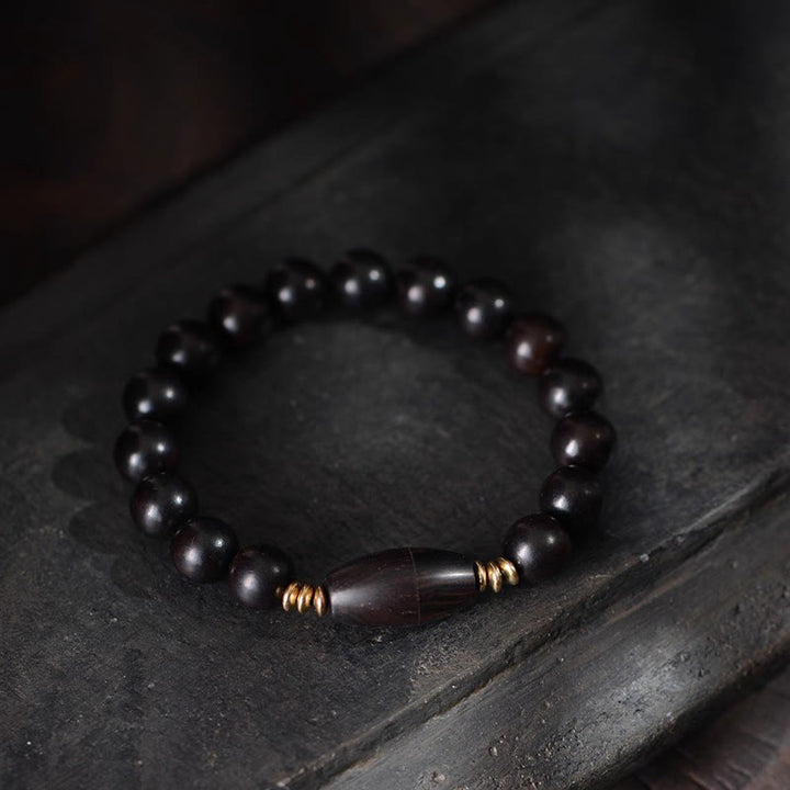 Bracelet de protection en perles d'ébène et Buddha Stones, orné d'un parchemin de sutra et symbole de bénédiction. - image 3
