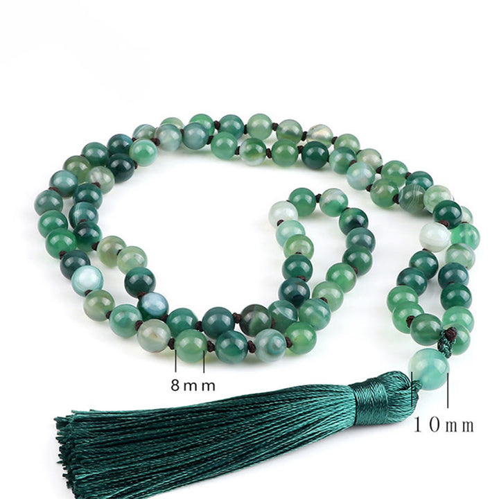 Bracelet de protection en Buddha Stones et pompon en malachite - image 1