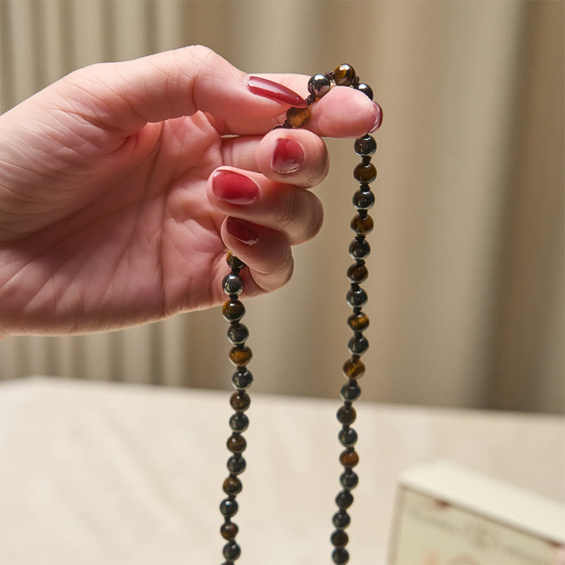 Mala de 108 Buddha Stones , œil de tigre et hématite, avec pompon, symbole de courage et de force - image 4