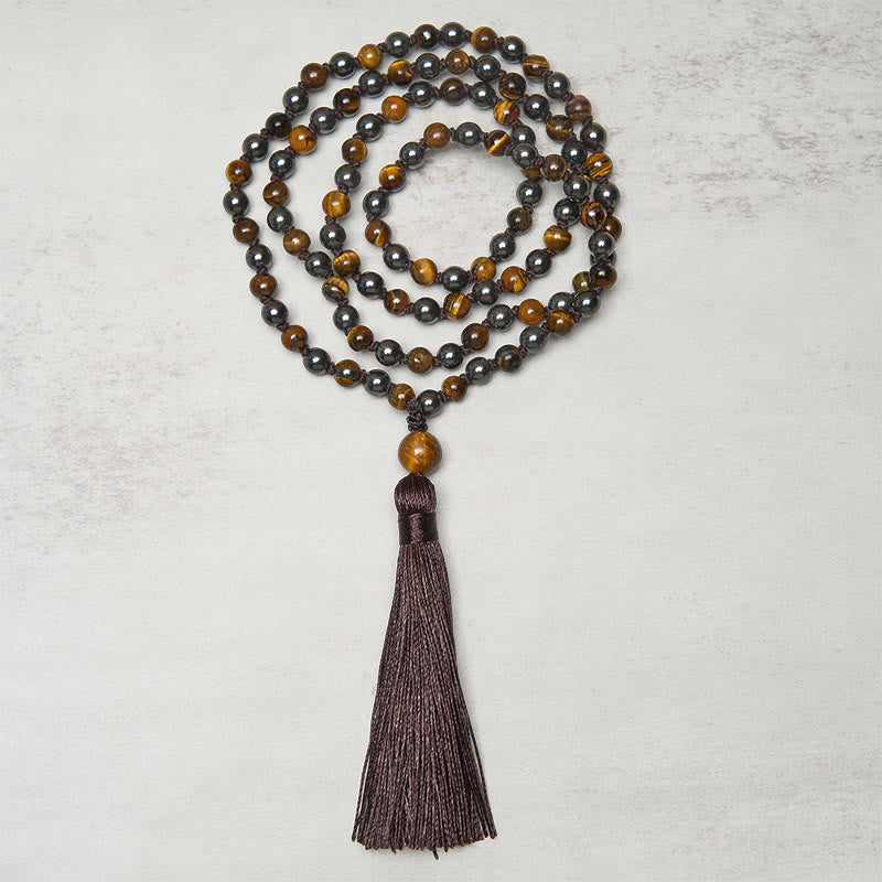 Mala de 108 Buddha Stones , œil de tigre et hématite, avec pompon, symbole de courage et de force - image 1