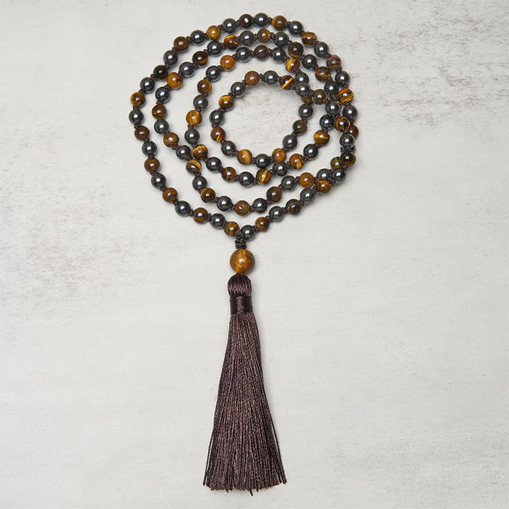 Mala de 108 Buddha Stones , œil de tigre et hématite, avec pompon, symbole de courage et de force - image 1