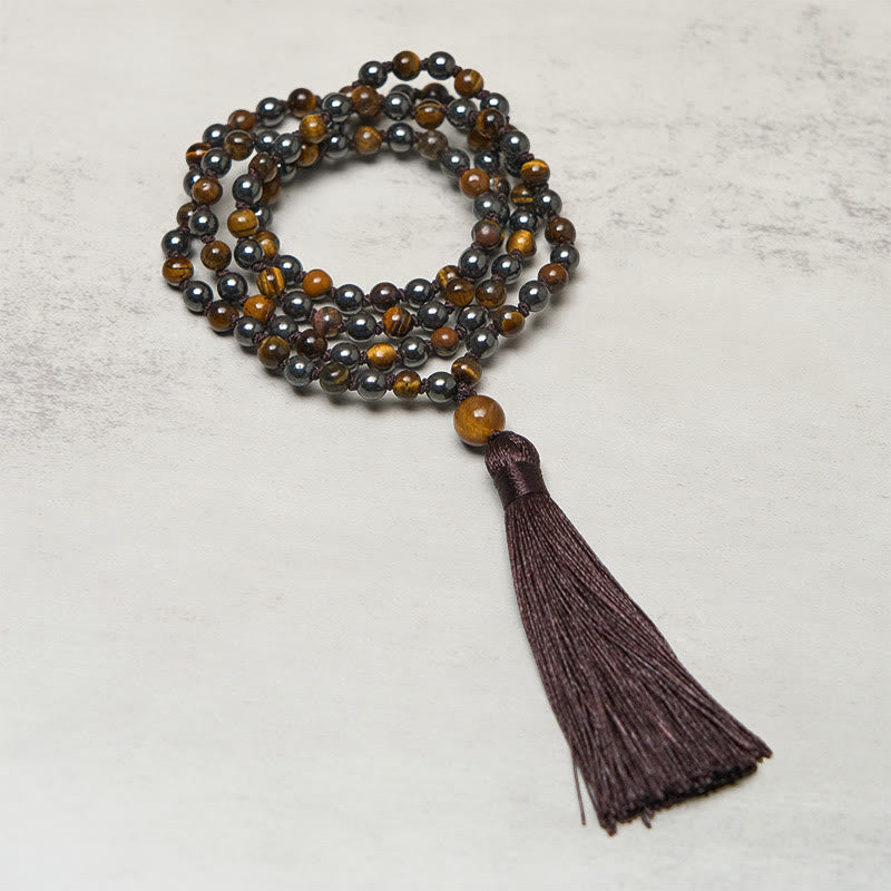 Mala de 108 Buddha Stones , œil de tigre et hématite, avec pompon, symbole de courage et de force - Œil de tigre et hématite - image 0