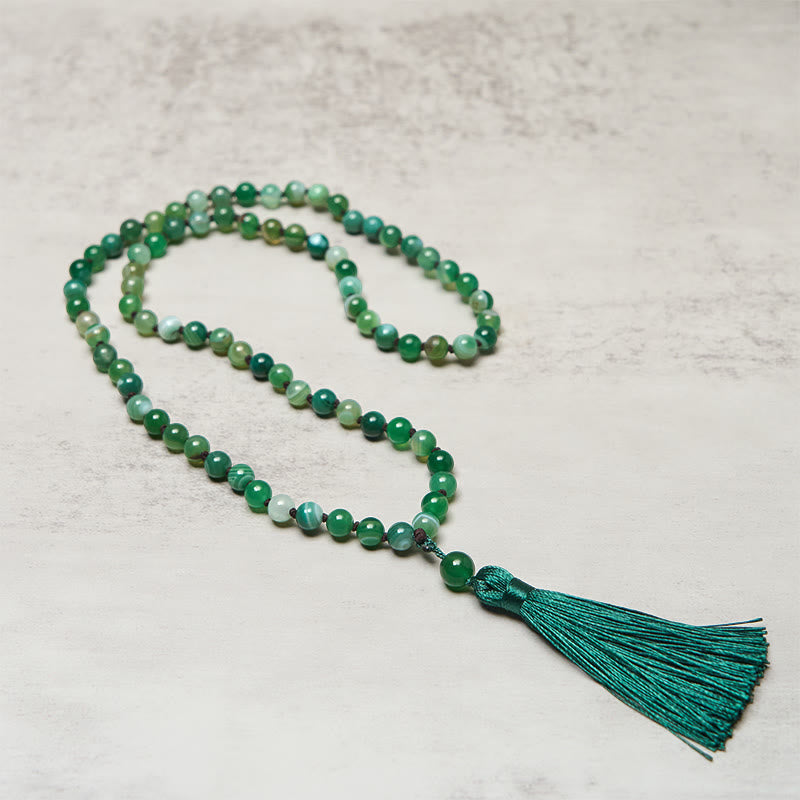 Bracelet de protection en Buddha Stones et pompon en malachite - image 2