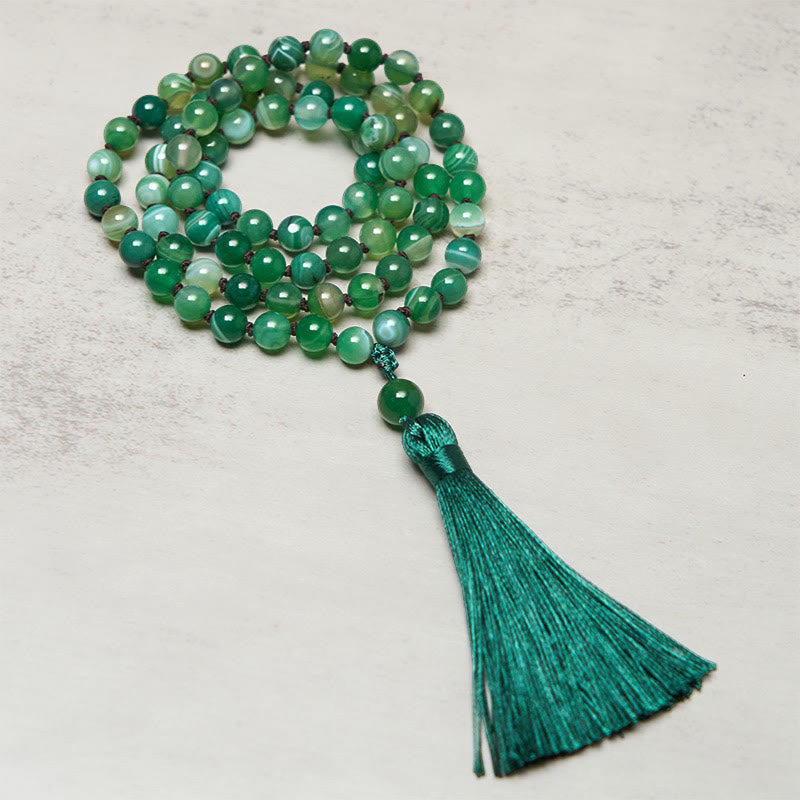 Bracelet de protection en Buddha Stones et pompon en malachite - image 1