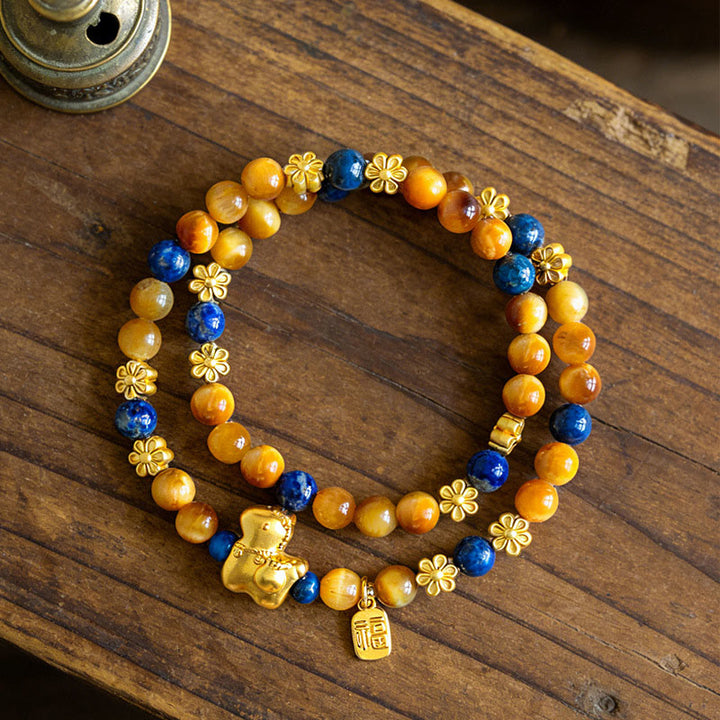Bracelet double tour Sérénité en lazurite, lapis-lazuli et œil de tigre, orné de Buddha Stones et représentant le personnage Fu de l'année du Cheval. - image 3