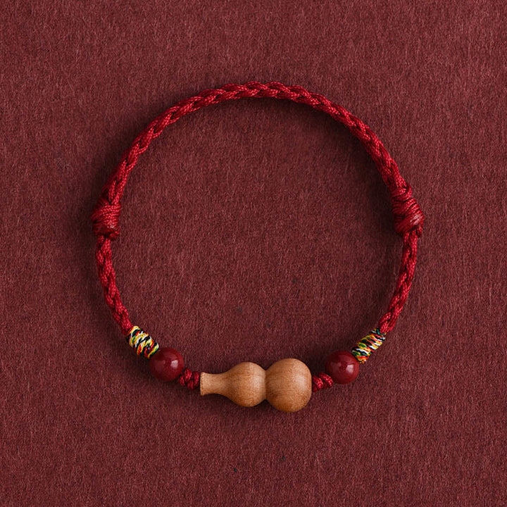 Bracelet porte-bonheur ajustable en Buddha Stones, calebasse et corde en bois de pêcher - Cordon rouge foncé (Tour de poignet : 15-19 cm) - image 0