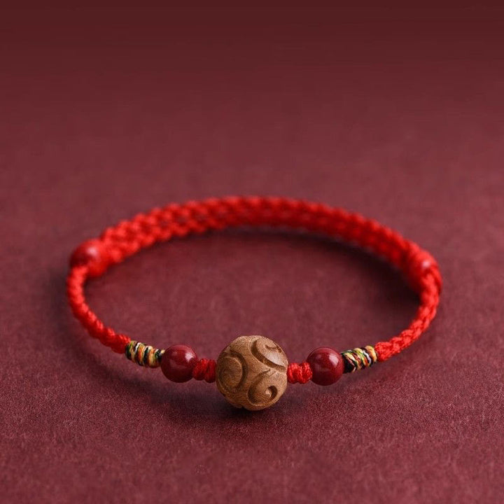 Bracelet porte-bonheur en corde de bois de pêcher naturel sculpté dans des Buddha Stones , orné d'un motif de bon augure - image 0