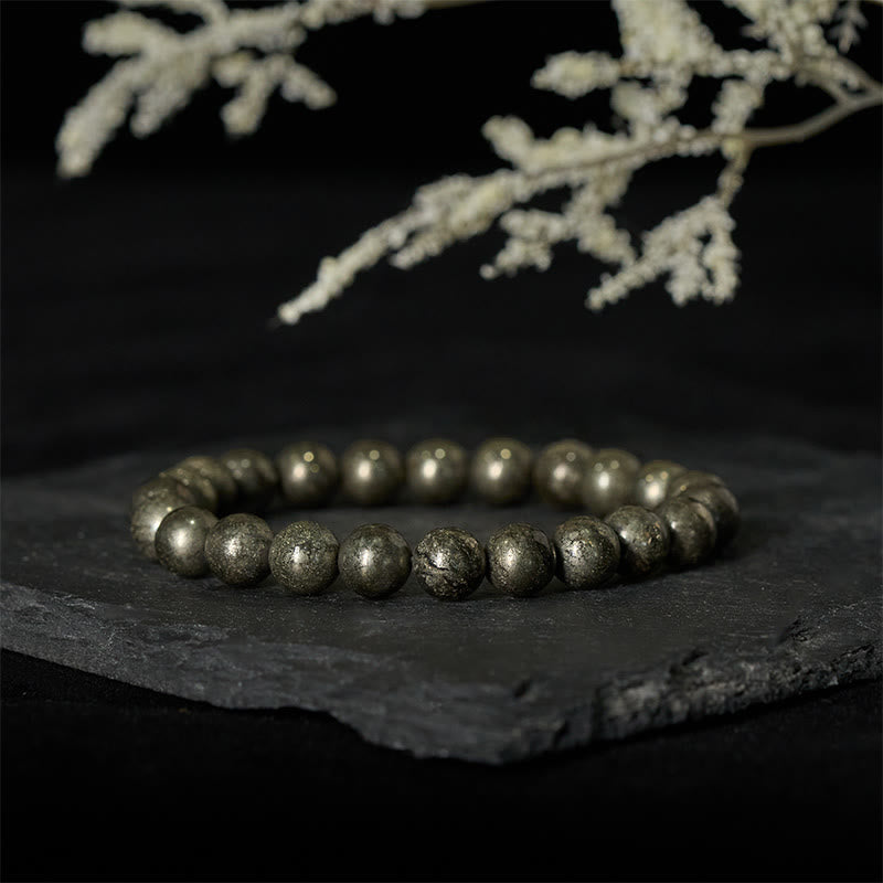 Bracelet de perles rondes en pyrite et Buddha Stones, symbole de confiance et d'abondance - image 1
