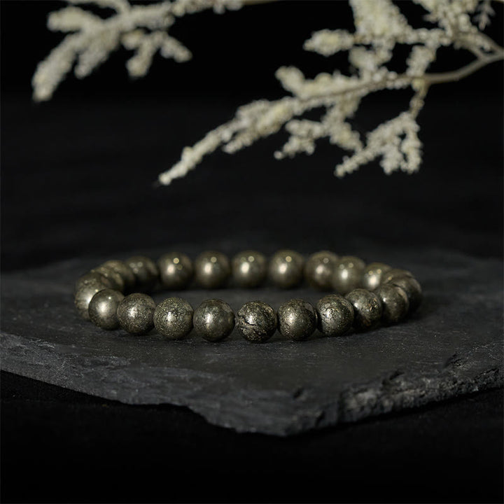 Bracelet de perles rondes en pyrite et Buddha Stones, symbole de confiance et d'abondance - image 1