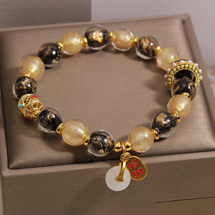 Buddha Stones Bracelet porte-bonheur en perles de verre Liuli noir et or, symbole de richesse et de paix - image 1