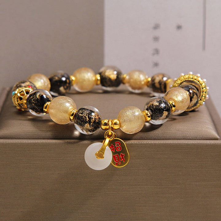 Buddha Stones Bracelet porte-bonheur en perles de verre Liuli noir et or, symbole de richesse et de paix - 14-16 cm - image 0