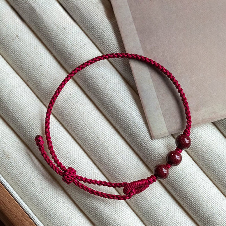 Buddha Stones Bracelet en corde tressée avec perles de cinabre faites à la main, symbole de calme et de bénédiction - image 1