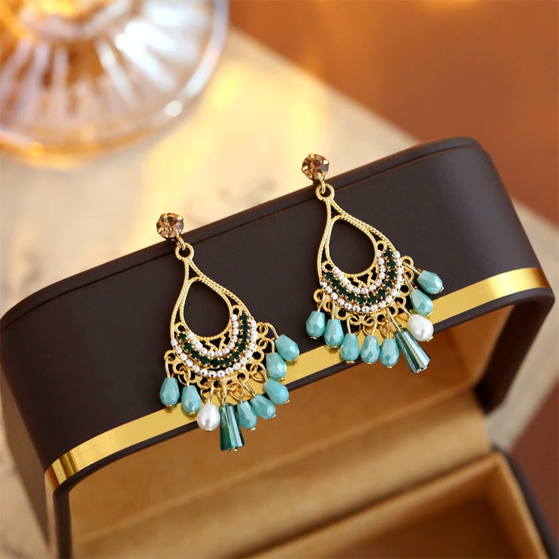 Buddha Stones Boucles d'oreilles pendantes en cuivre ajouré avec pompon en forme de larme, idéales pour prendre soin de soi - image 1
