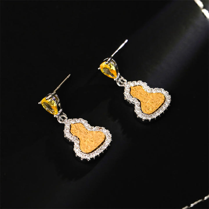 Buddha Stones Boucles d'oreilles puces en cuivre et zircon doré, symbole de richesse, en forme de gourde. - image 1