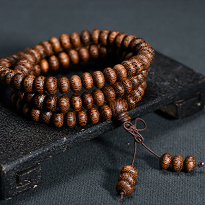 Buddha Stones Mala de 108 perles en bois texturé pour une énergie apaisante - 6*9mm*108 - image 0